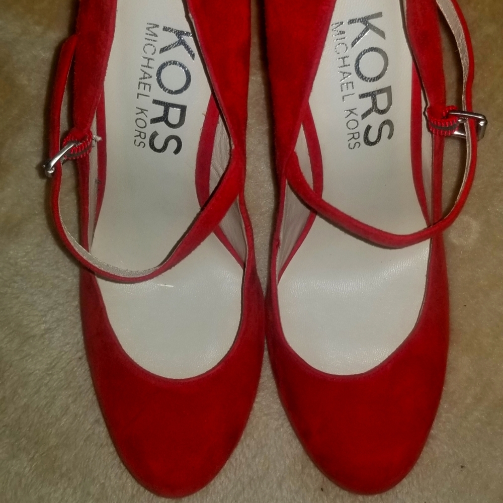 Micheal kors red suede pumps. Goergous heels in mint condition.